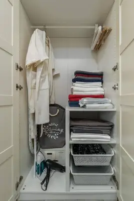 a walk in closet filled with towels and clothes at A1 The Title Nayang Стильная квартира in Nai Yang Beach