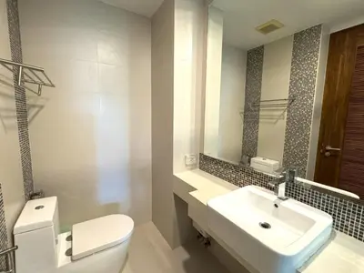 a bathroom with a white toilet and a sink at Peaceful Rawai studio with washer by Lofty in Rawai Beach