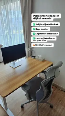 an office with a desk with a monitor and a chair at Stylish Apartment with Workspace 10 Minutes from the Beach for min 30 Day Stays in Phuket Town