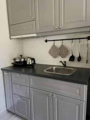a kitchen counter with a sink and white cabinets at B4 БАССЕЙН ВаТСАП669З582I976 in Nai Yang Beach