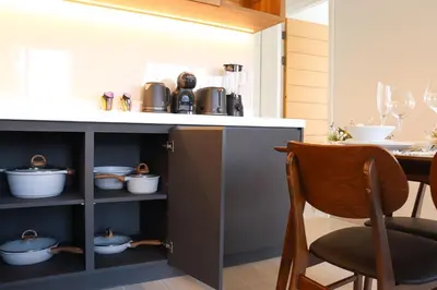 a kitchen with a counter with pots and pans at Lakeside Residences by NLA in Bang Tao Beach