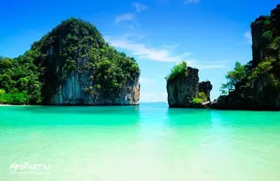 a view of a beach with some rocks in the water at XX Bao Pathong Beach เบา ภูเก็ต หาดป่าตอง in Patong Beach