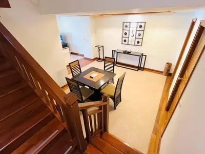 an overhead view of a dining room and living room at Laguna Village by RESAVA in Layan Beach