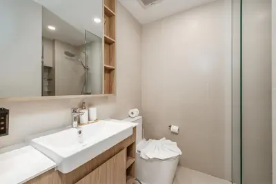 a bathroom with a sink and a shower at Идеальные апартаменты в Laguna Skypark in Phuket Town