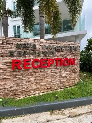 a brick wall with a sign that reads reactrification at Sea View One Bedroom Condo in Kata Beach in Kata Beach