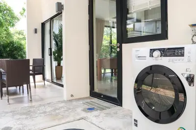 a washer and dryer in a house at Big Garden Townhouse Laguna Park in Phuket Town