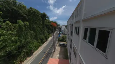 a view from the balcony of a building at Chollada Inn in Kamala Beach
