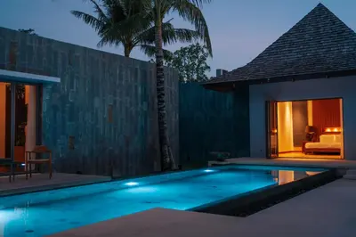 a swimming pool in front of a villa at Allure Villa in Bangtao in Ban Pak Lak