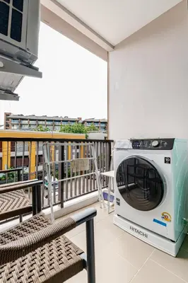a microwave on the balcony of a building at The Proud Rawai Studio in Phuket Town