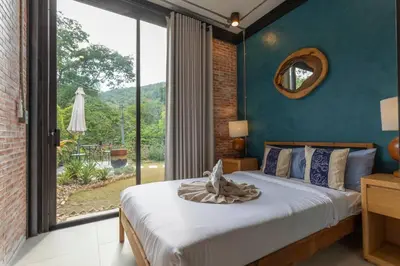 a bedroom with a bed and a large window at New Ultra Modern Designer Furniture Gym #v62 in Chalong