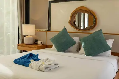 a hotel room with two beds with towels on them at New Ultra Modern Designer Furniture Gym #v62 in Chalong