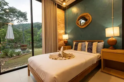 a bedroom with a bed with a large window at New Ultra Modern Designer Furniture Gym #v62 in Chalong