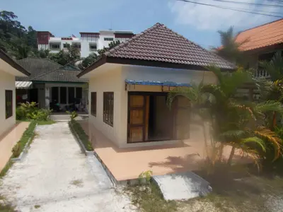 a small house with a pathway in front of it at Absolute calm for long sleepers and others in Kamala Beach