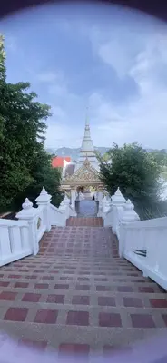 a large white building with a staircase leading to it at Green Tree Cottage3 in Klong Muang Beach