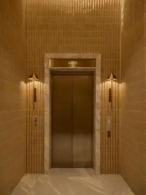 a elevator in a building with aoda sign on the wall at Arco Phuket Town in Phuket Town