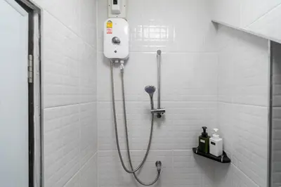 a bathroom with a shower stall with a shower at Bangla Patong Pool Villas with 4 Villas different designs choose fro, photo before Book in Patong Beach