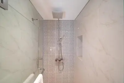 a bathroom with a shower with a shower head at Deluxe apartment at Cassia Residences by Lofty in Bang Tao Beach
