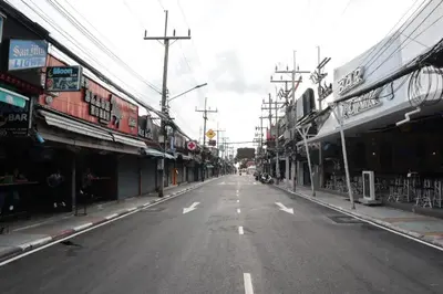 an empty street in a city with buildings at OYO 472 Tang Cheng Holiday Hotel in Patong Beach
