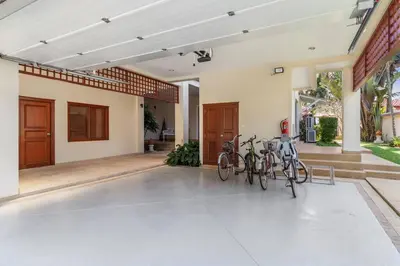 two bikes parked on the front of a house at Laguna Fairway View Villa in Bang Tao Beach