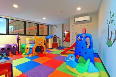 a childrens play room with toys on the floor at Новая квартира с выходом к бассейну in Mai Khao Beach