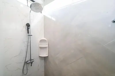 a bathroom with a shower with a toilet in it at Garden pool villa V110 in Kata Beach