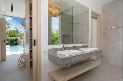 a bathroom with two sinks and a large mirror at Tropical Brand New 4BR Pool Villa Mina, just 5 min Drive from Naiharn in Rawai Beach