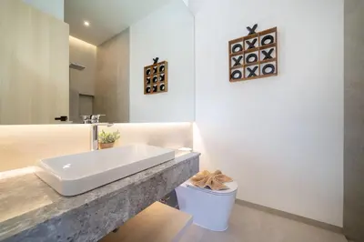 a white bathroom with a sink and a toilet at Tropical Brand New 4BR Pool Villa Mina, just 5 min Drive from Naiharn in Rawai Beach