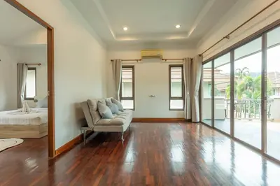 a living room with a couch and a bed and a mirror at Center Stay from Patong Bangla Walking Street V107 in Patong Beach