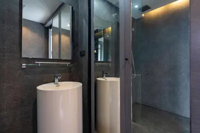 a bathroom with two white sinks and a mirror at Tropics Pool View 2BR Kamala Apartment CTG P605-6, near Beach in Kamala Beach