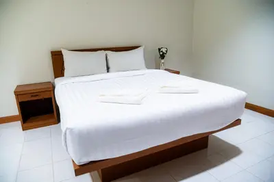 a large white bed with two white towels on it at Diamond Place Ao Nang in Ao Nang Beach