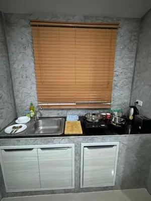 a kitchen with a sink and a counter top at Mimi Home in Ko Yao Noi