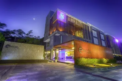 a large building with lights on it at night at Escape Villa in Ban Bang Khu