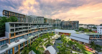 an aerial view of a city with buildings at Mida Grande Resort Surin by Mill in Surin Beach