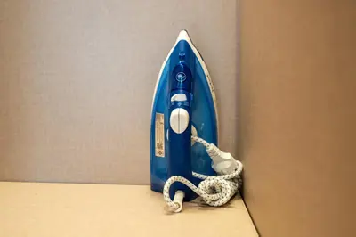 a blue surfboard leaning against a wall at Laguna Lakeside apartments with panoramic view in Bang Tao Beach