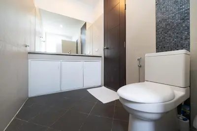 a bathroom with a white toilet and a mirror at 2 Bedrooms Villa in Rawai - v6 t in Ban Saiyuan (1)