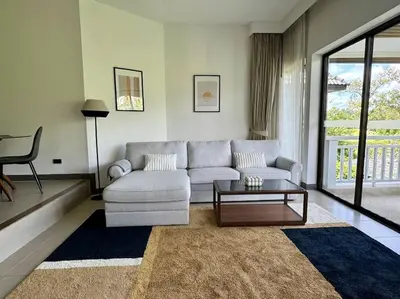a living room with a couch and a coffee table at Allamanda Laguna Phuket 2 bedroom apartment Bang Tao Beach in Laguna Phuket
