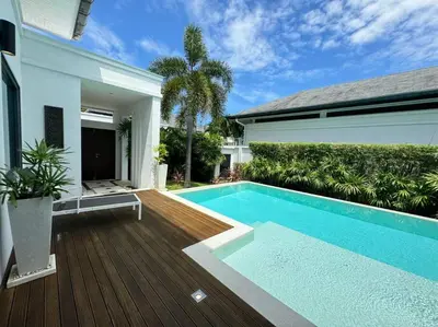 a swimming pool in the backyard of a house at Aromdee 2 Villa by G Estate Phuket in Ban Saiyuan (1)