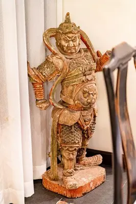 a statue of a god standing on a rock at Baan Mandala Villa 4 in Bang Tao Beach