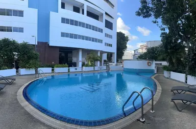 a large swimming pool in front of a building at Apartment in Patong Tower in Patong Beach