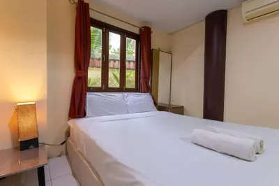a bedroom with a large white bed with a window at V235 Huge Pool 4 Mins Kamala Beach 12 Mins Patong in Kamala Beach