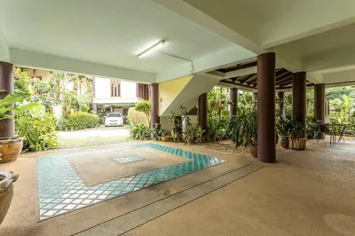 a swimming pool in the middle of a courtyard at V235 Huge Pool 4 Mins Kamala Beach 12 Mins Patong in Kamala Beach