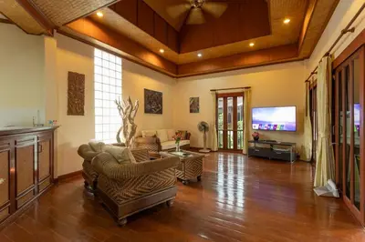 a living room with furniture and a flat screen tv at V235 Huge Pool 4 Mins Kamala Beach 12 Mins Patong in Kamala Beach