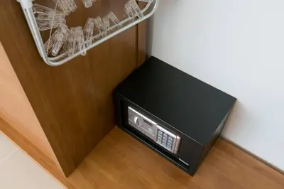 a black box sitting on the floor next to a closet at Wow Academy & Stay Soi Tai-Aed 3B in Ban Suan