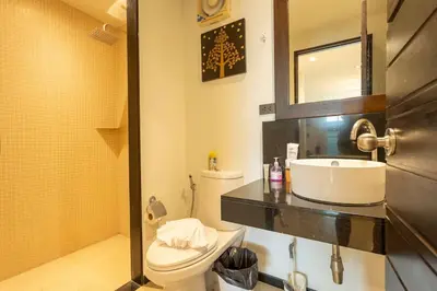 a bathroom with a toilet and a sink at Oxygen 3BR Walk to Shops, Bars, Private Pool v113 in Rawai Beach