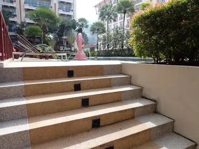 a set of stairs with a statue in a city at Private apartment at Phuket Villa Condo in Patong Beach