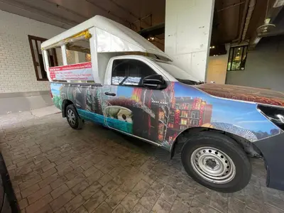 a food truck parked in a building with its door open at EMERALD TERRACE CONDO 52-FAMILY 1 Bedroom POOL VIEW in Patong Beach