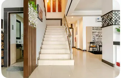 a stairway in a building with a stair case at The Star House in Patong Beach