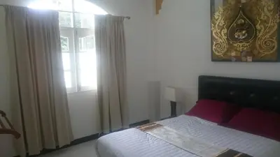 a bedroom with a bed and a window at Villa Happy home in Rawai Beach