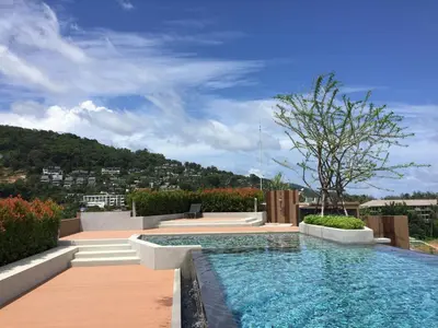 a swimming pool on the roof of a house at Cozy Surin apartment at 6 Avenue by Lofty in Surin Beach