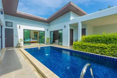 a swimming pool in front of a villa at 2 Beds large pool night market Soi Namjai v122 in Rawai Beach